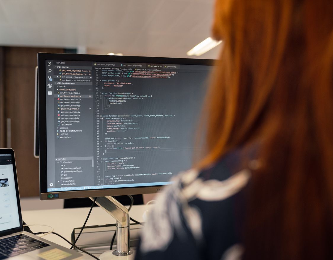 An engineer working at a code editor